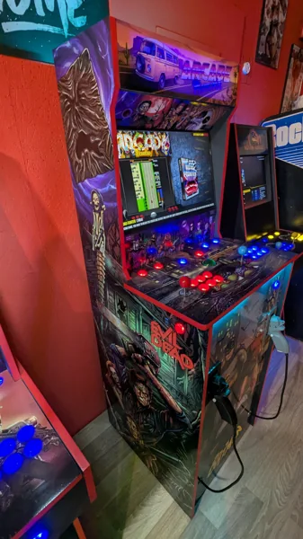 Illuminated Arcade Memories cabinet viewed from the Evil Dead side