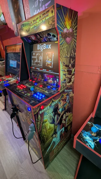 Illuminated Arcade Memories cabinet viewed from the Romeo + Juliet side