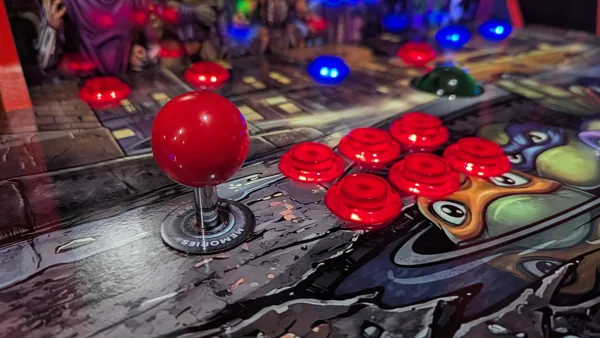 Red player-one joystick and LED buttons on the TMNT deck