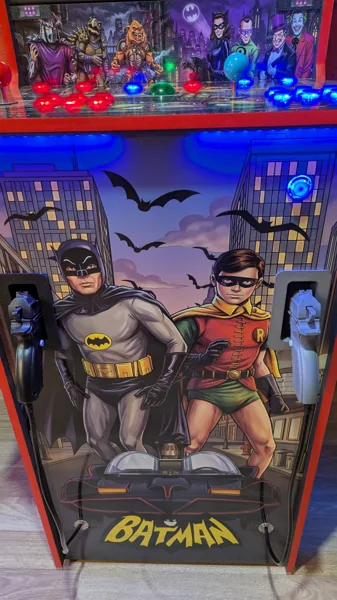 Batman and Robin front artwork with dual recoil light guns in their holsters