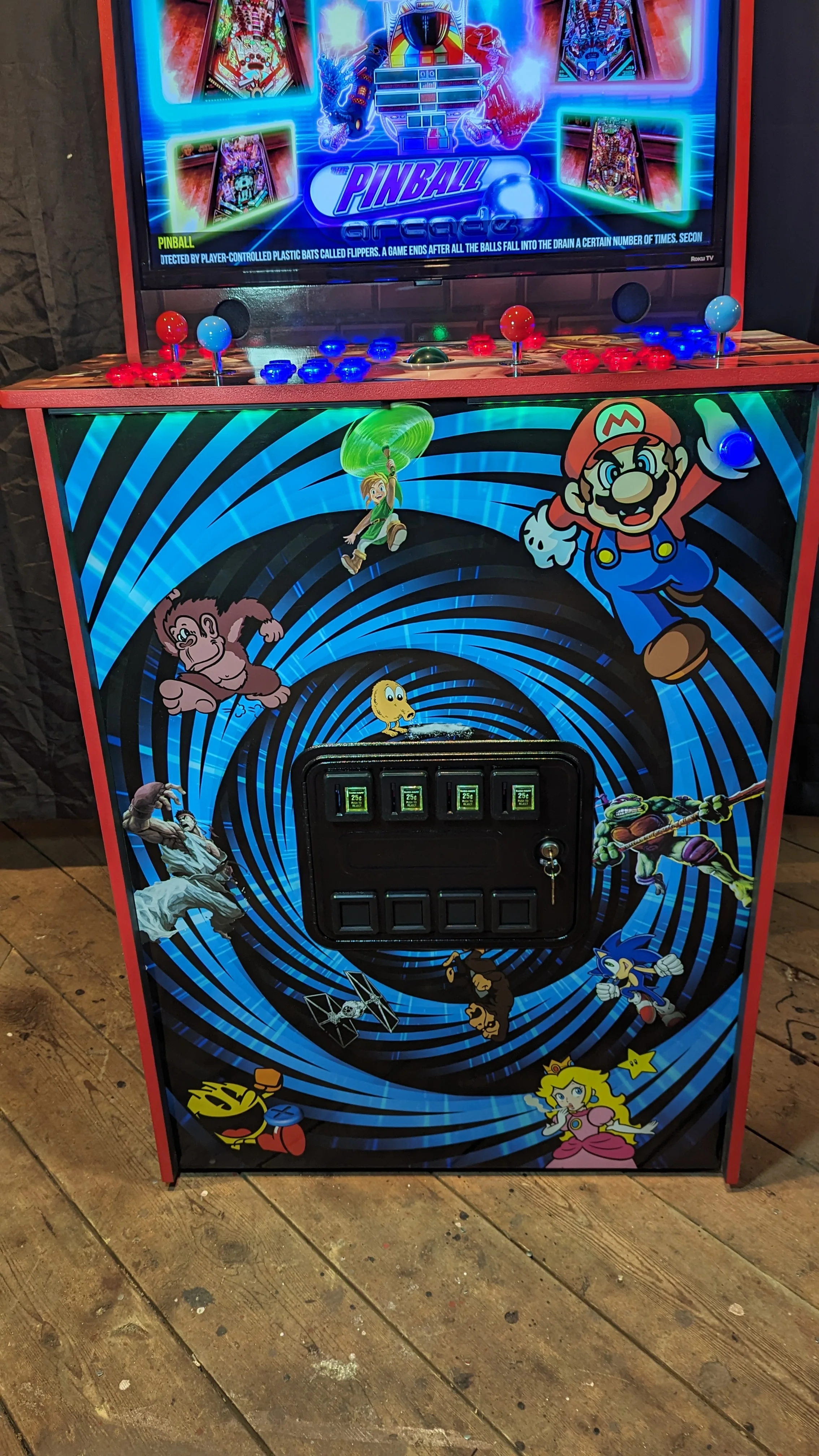 Real four-player commercial coin door on the arcade pinball karaoke machine