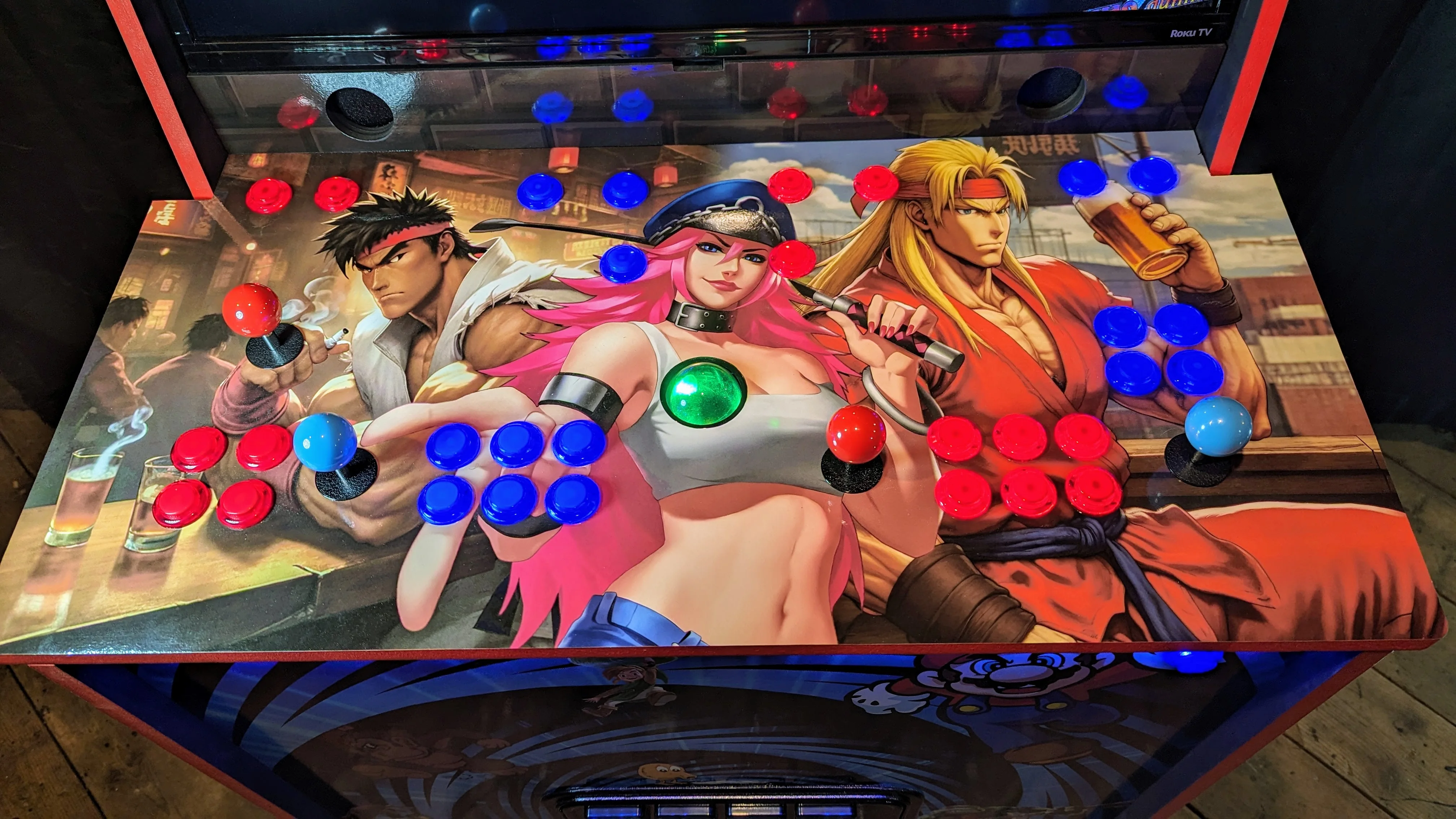Full four-player arcade control deck with illuminated buttons and trackball
