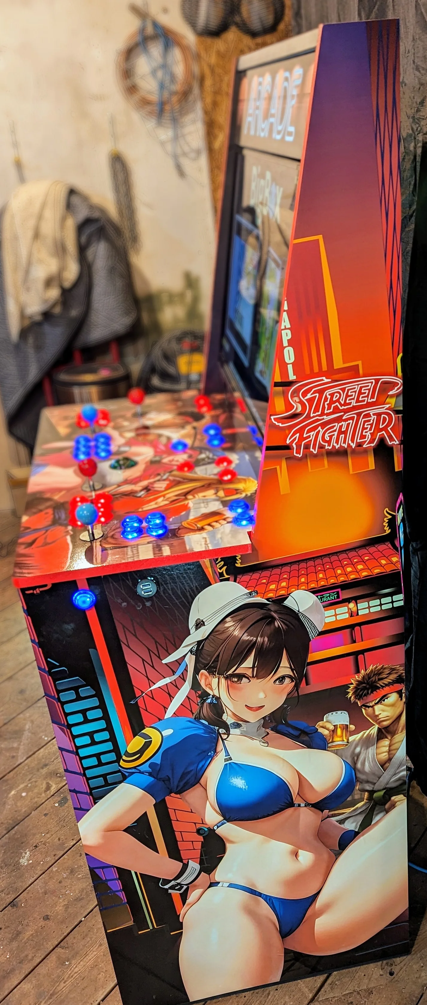 Right side of the arcade pinball karaoke cabinet with Chun-Li and Street Fighter artwork
