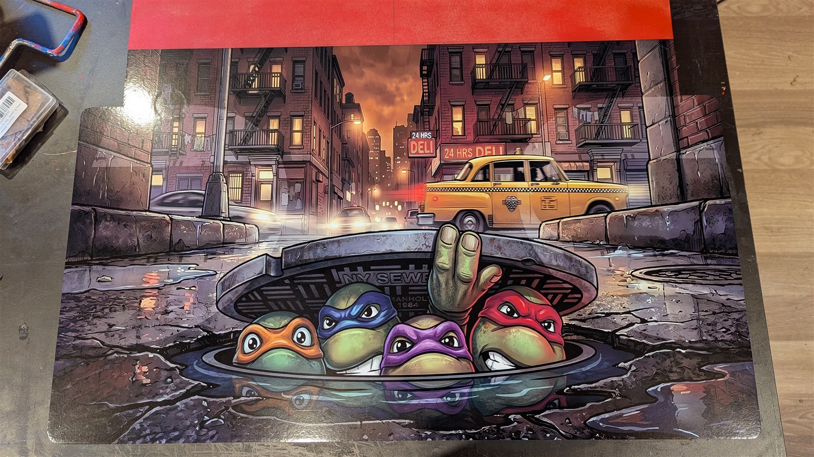 Teenage Mutant Ninja Turtles city artwork installed on the Arcade Memories control panel before the joysticks, buttons, and trackball are added