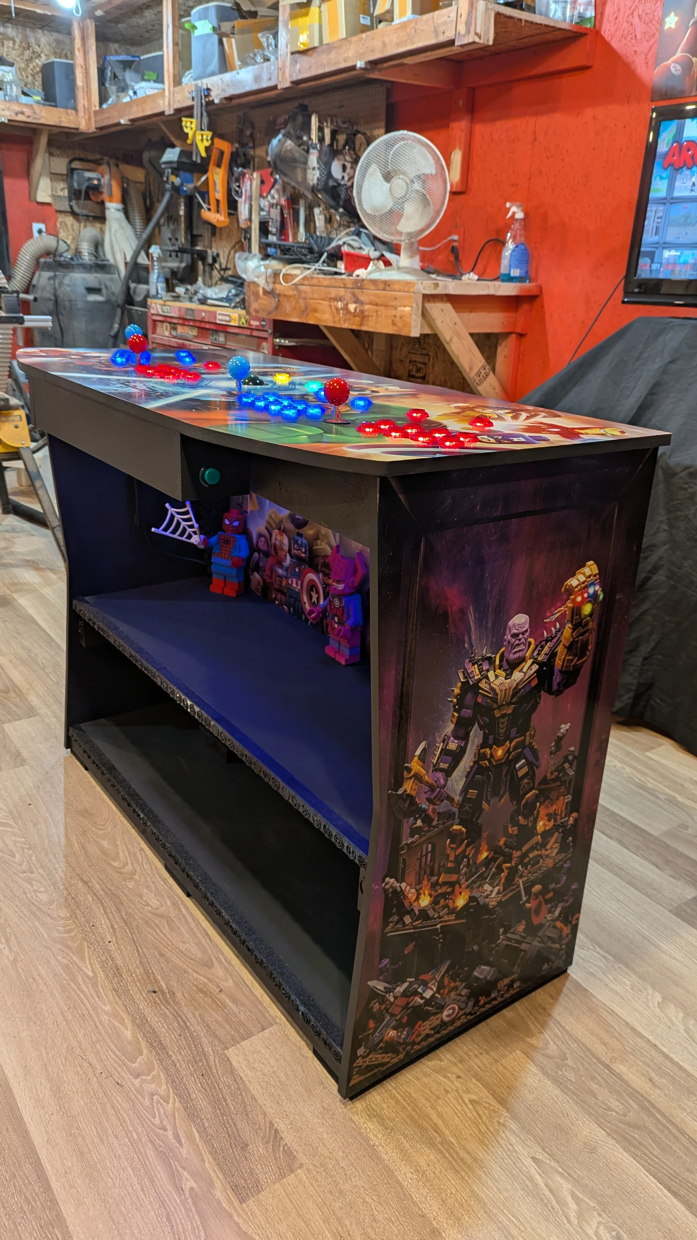 Finished LEGO Marvel Avengers pedestal arcade machine with Thanos side art and lit controls