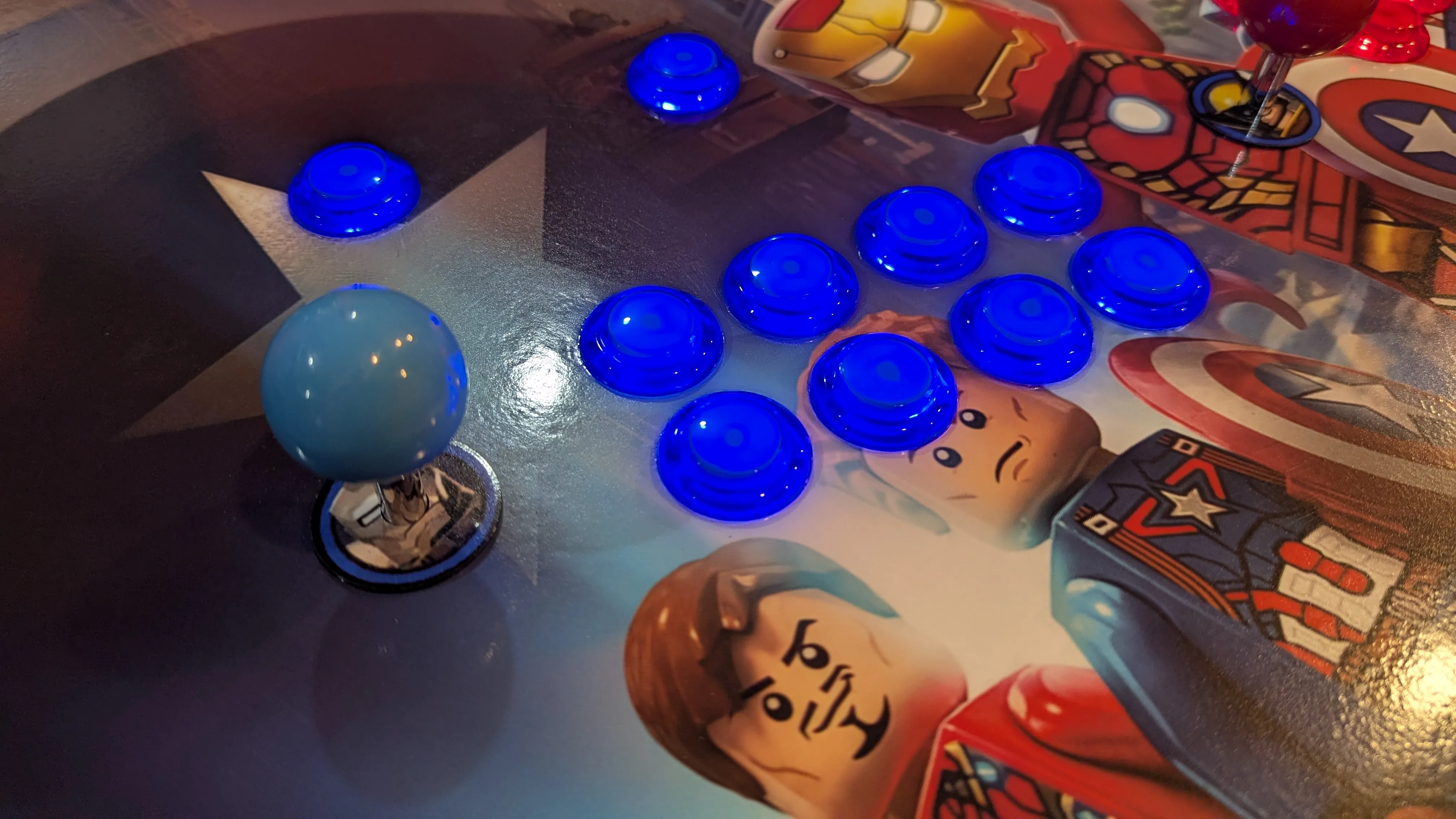 Close-up of blue LED buttons on LEGO Marvel Avengers control panel