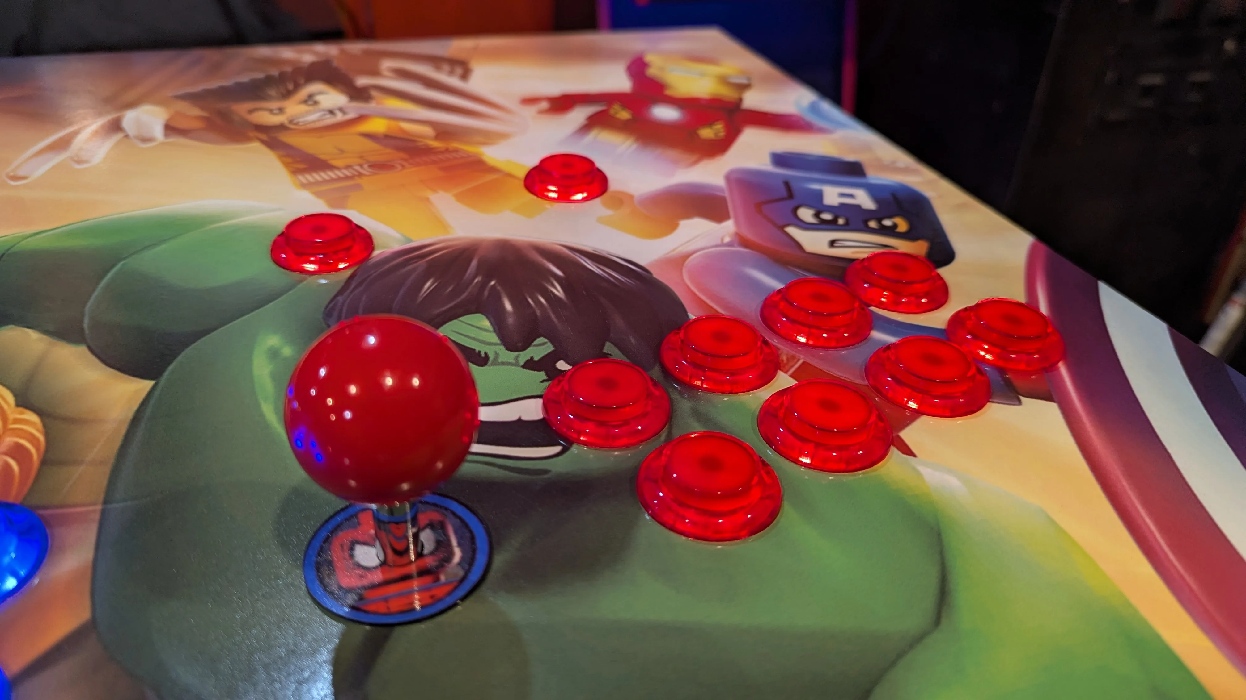 Close-up of Hulk and Captain America control area with red LED buttons