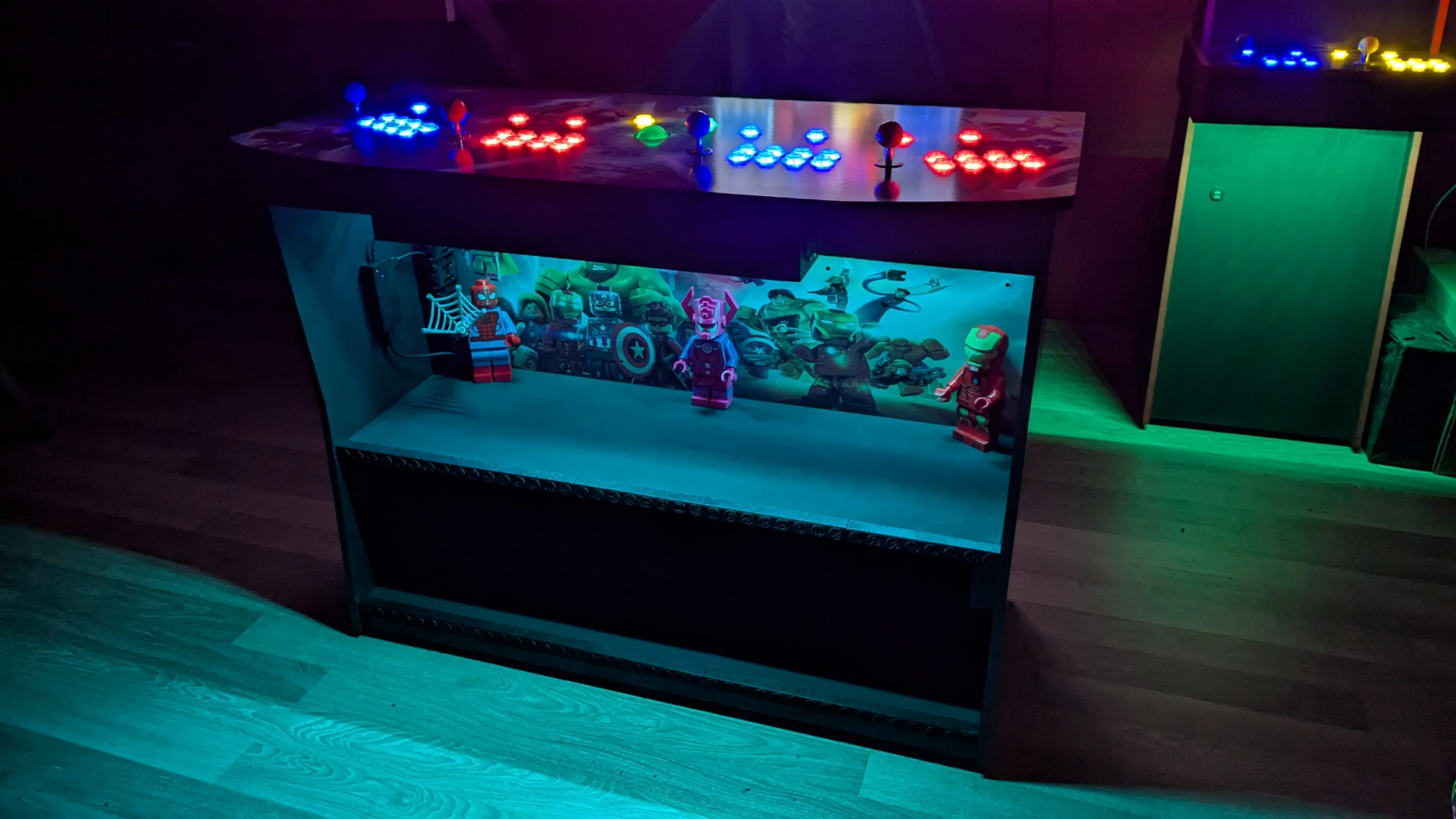 Finished LEGO Marvel Avengers pedestal with blue and green lighting