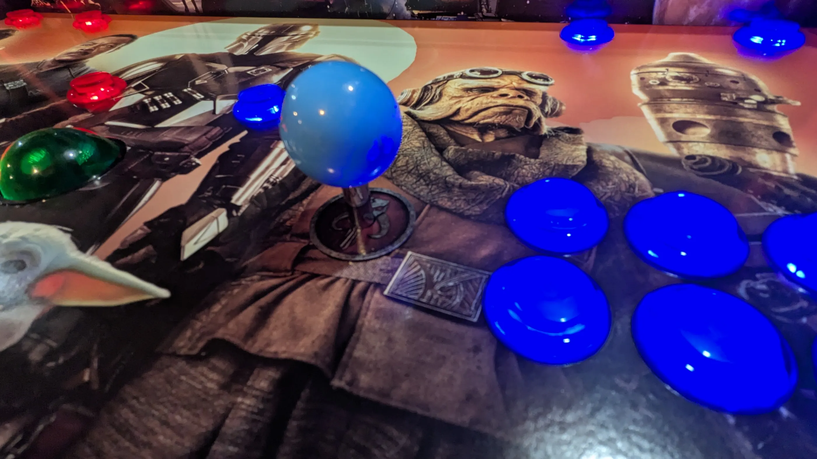 Blue illuminated player controls on the Mandalorian arcade machine