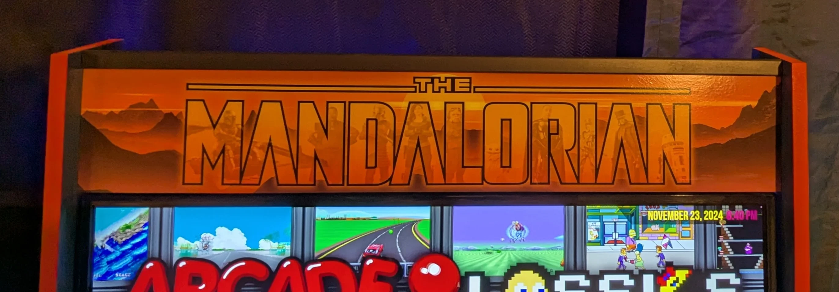 Close-up of the custom illuminated Mandalorian arcade marquee