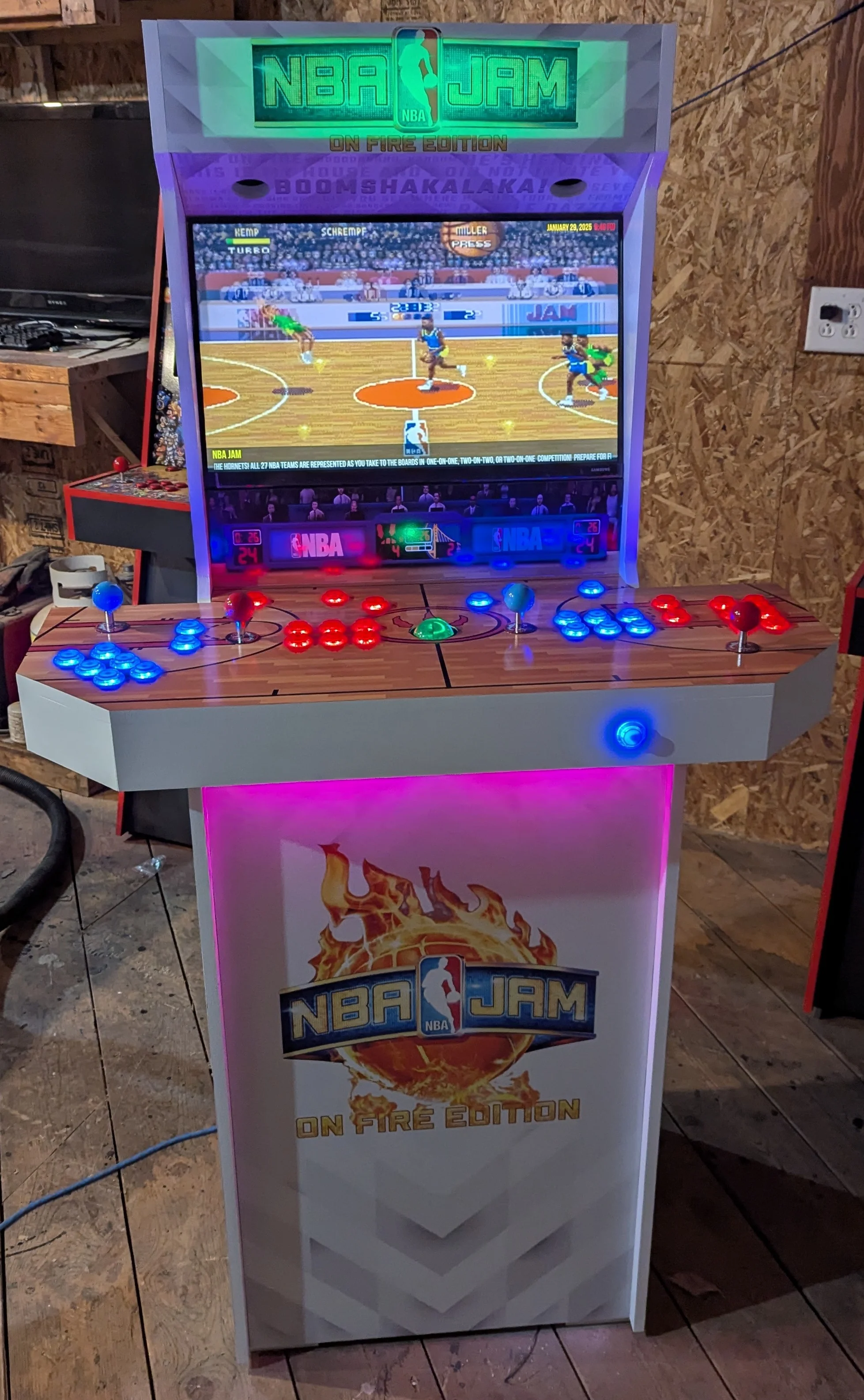 Closer front view of the illuminated NBA Jam arcade cabinet