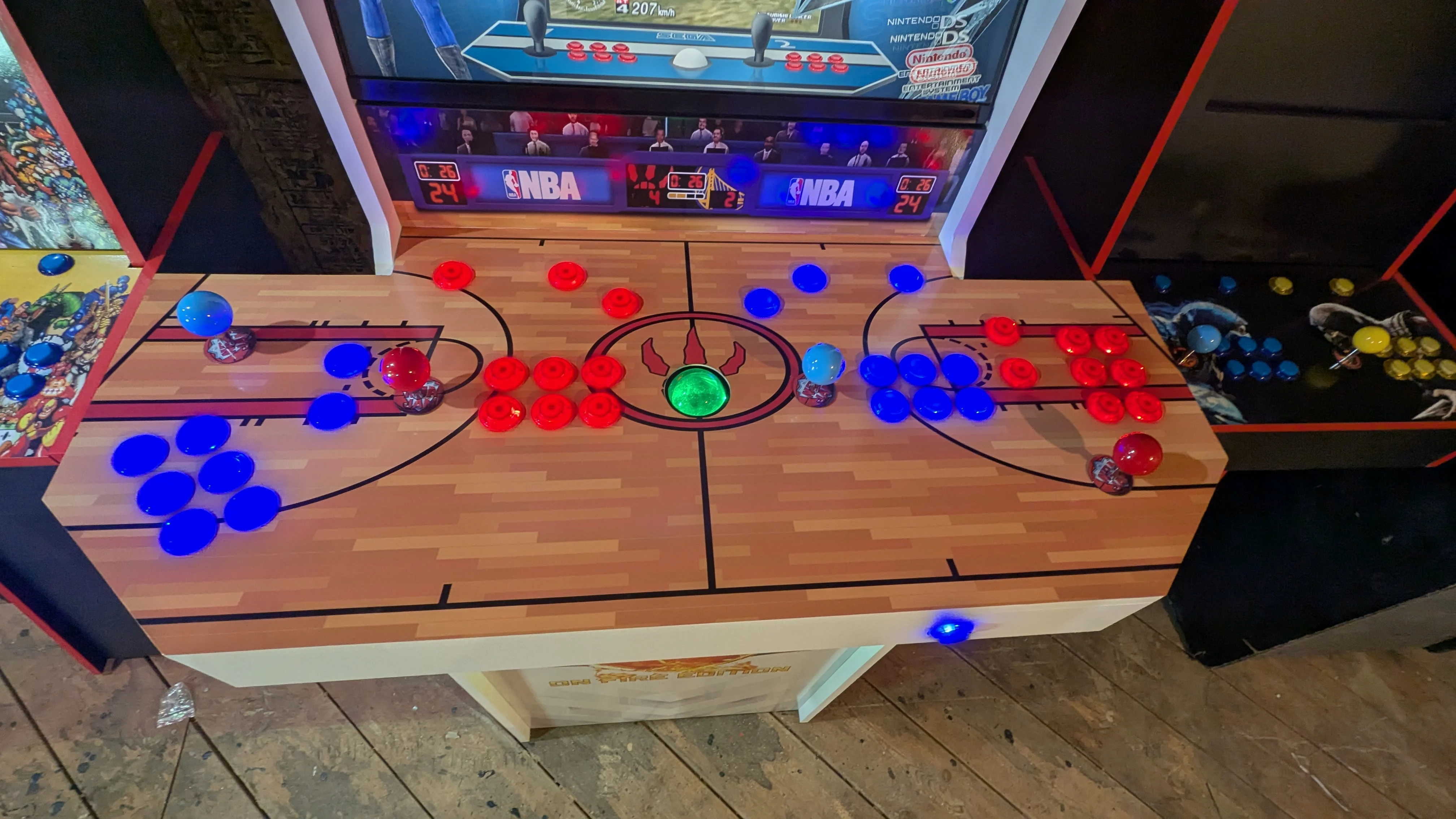 Overhead view of the NBA Jam four-player basketball court control panel