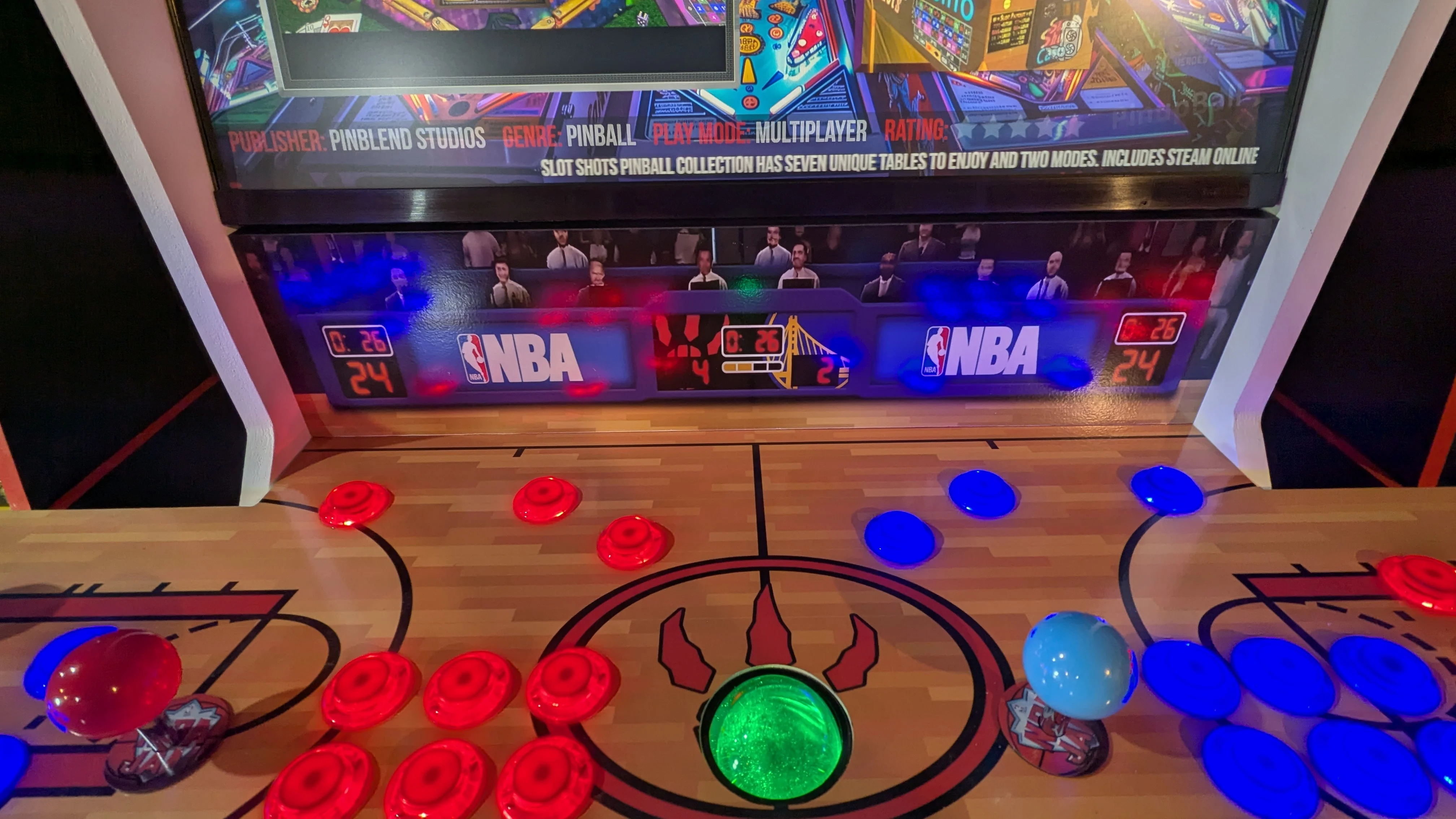 Close view of the illuminated scoreboard artwork and court control panel