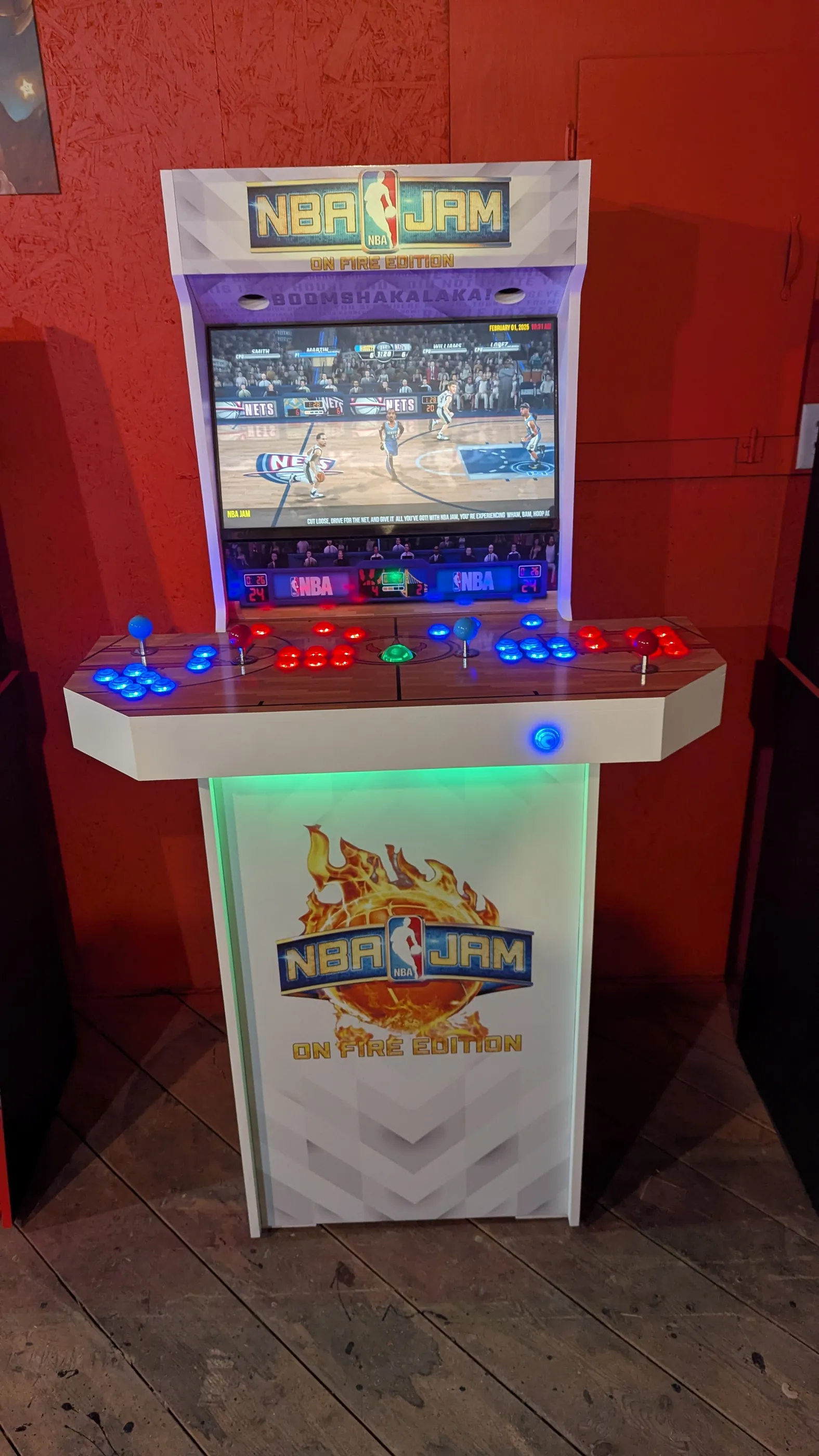 Front view of the finished NBA Jam On Fire Edition four-player arcade machine
