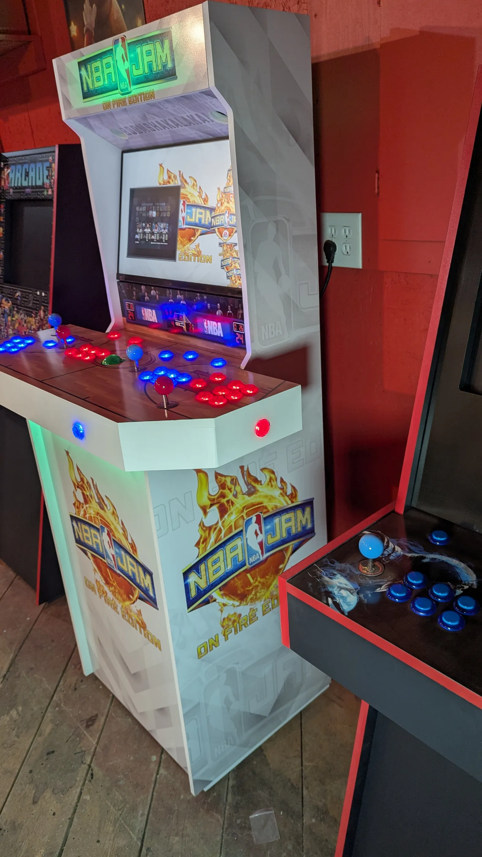 Side view of NBA Jam On Fire Edition custom four-player arcade machine