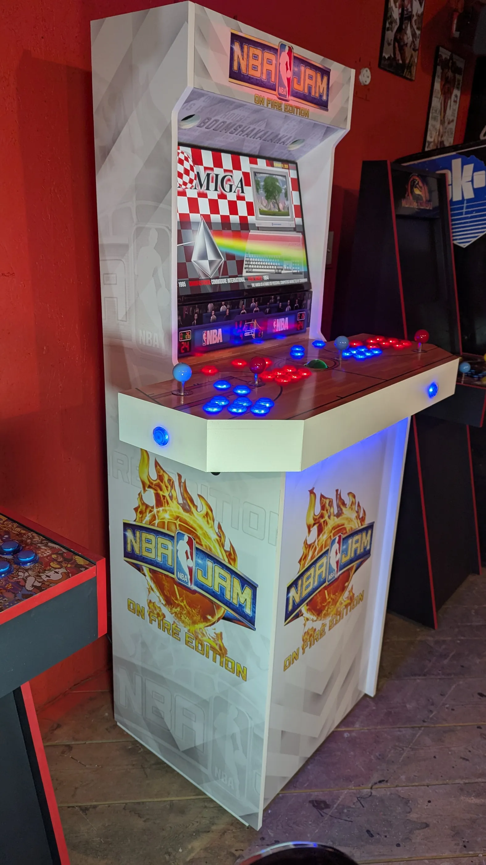 Right side view of the NBA Jam On Fire Edition arcade cabinet