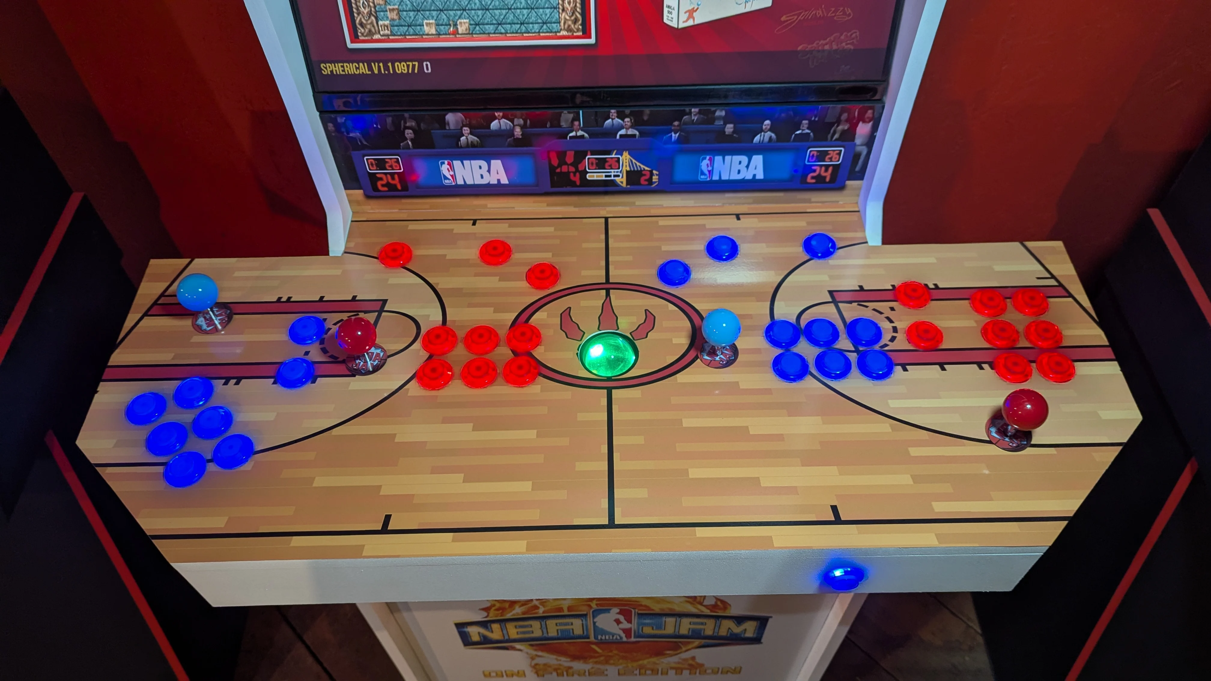 Overhead view of the NBA Jam four-player court control panel with LED buttons and trackball