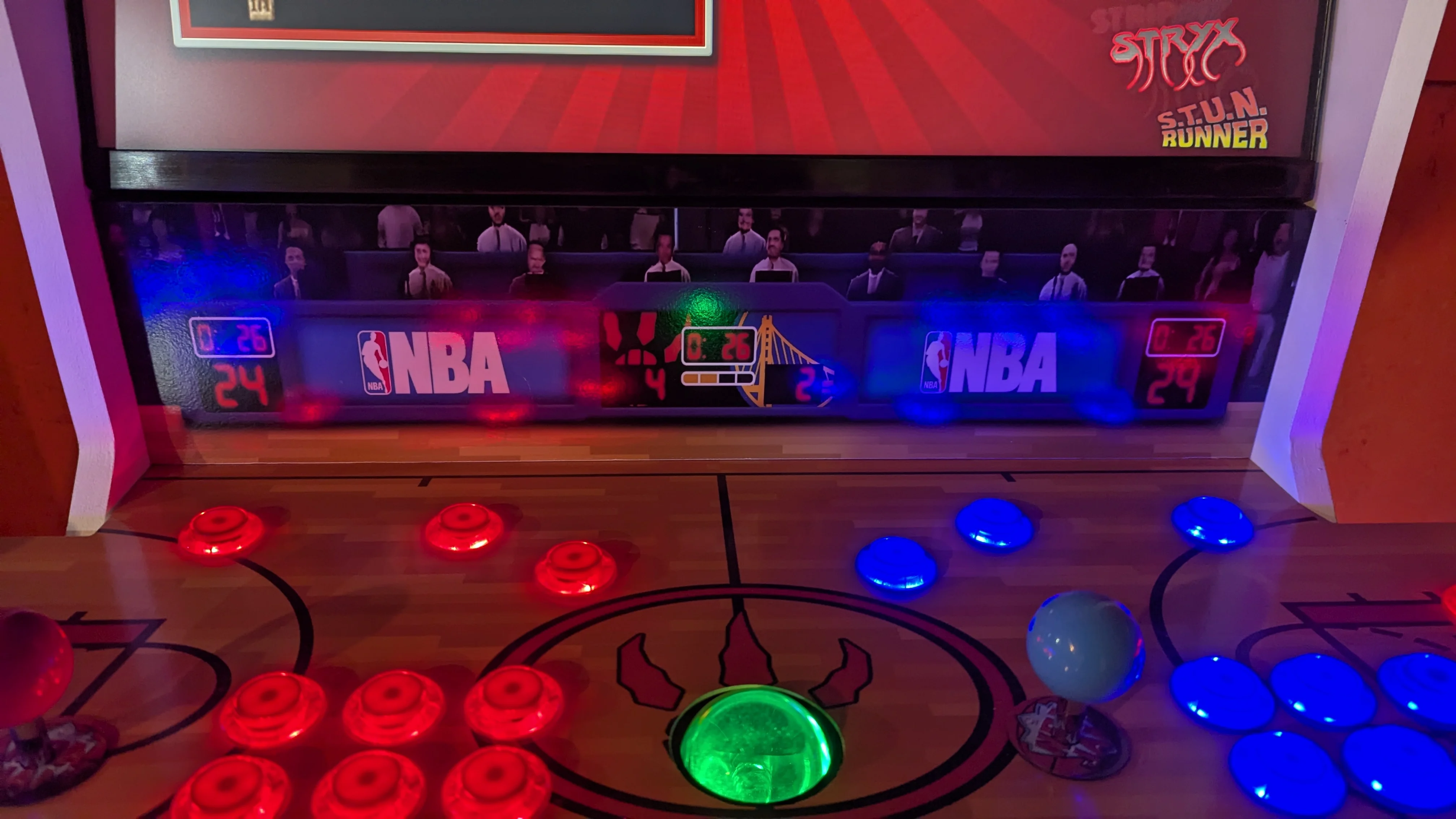 NBA scoreboard artwork above the red and blue LED arcade controls