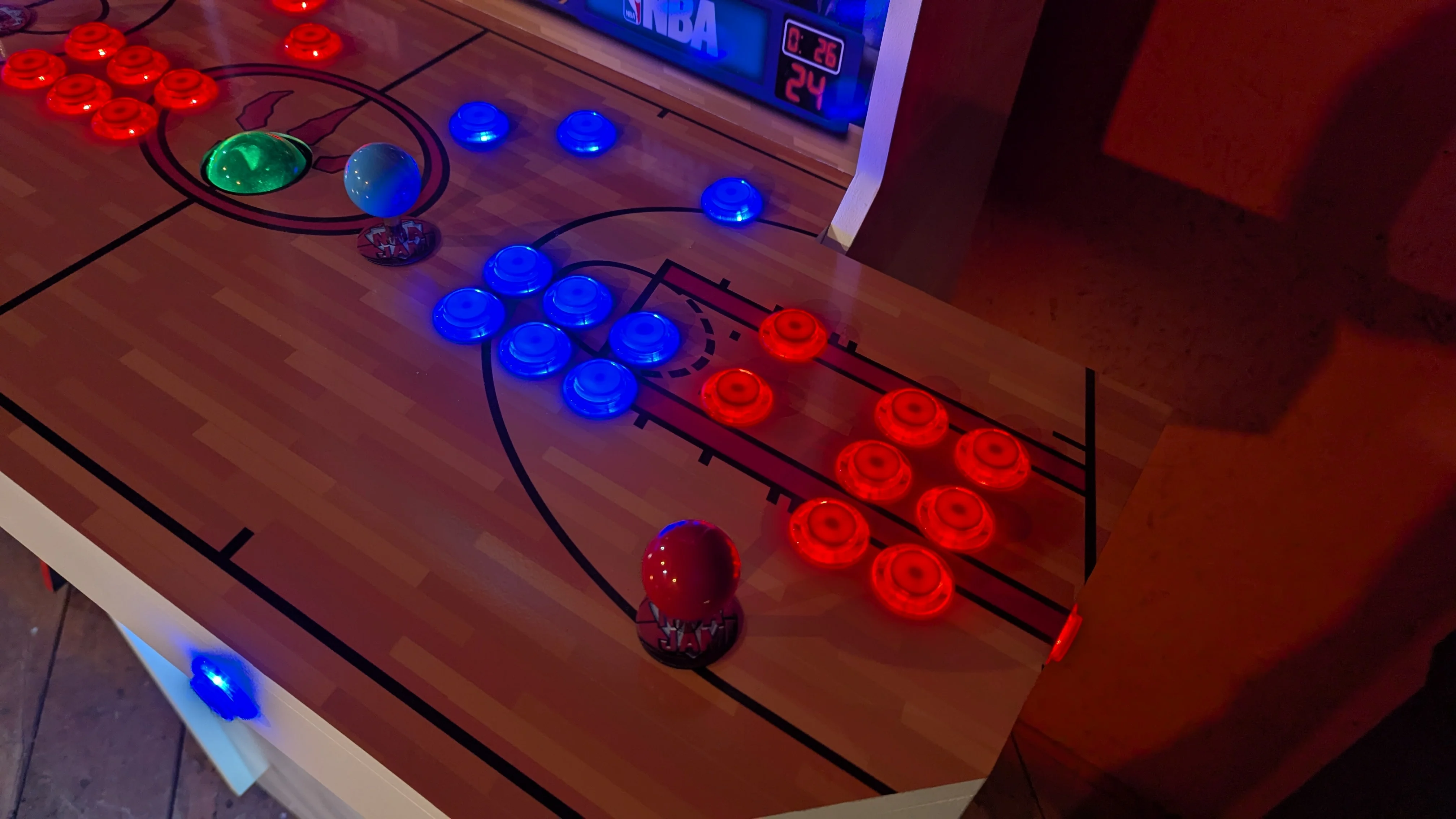 Close-up of player controls on the NBA Jam court panel