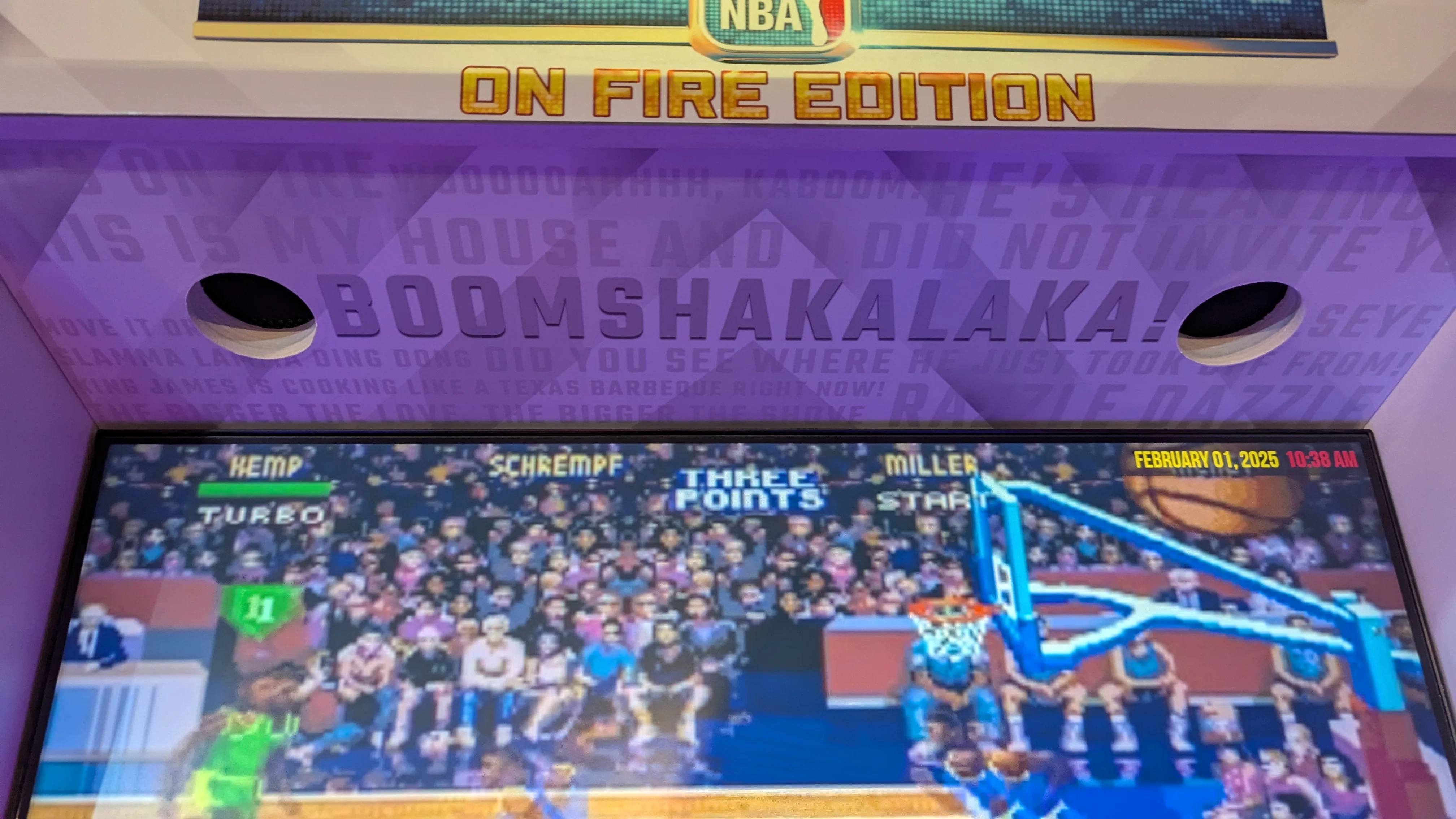 Boomshakalaka artwork and speaker openings above the arcade screen