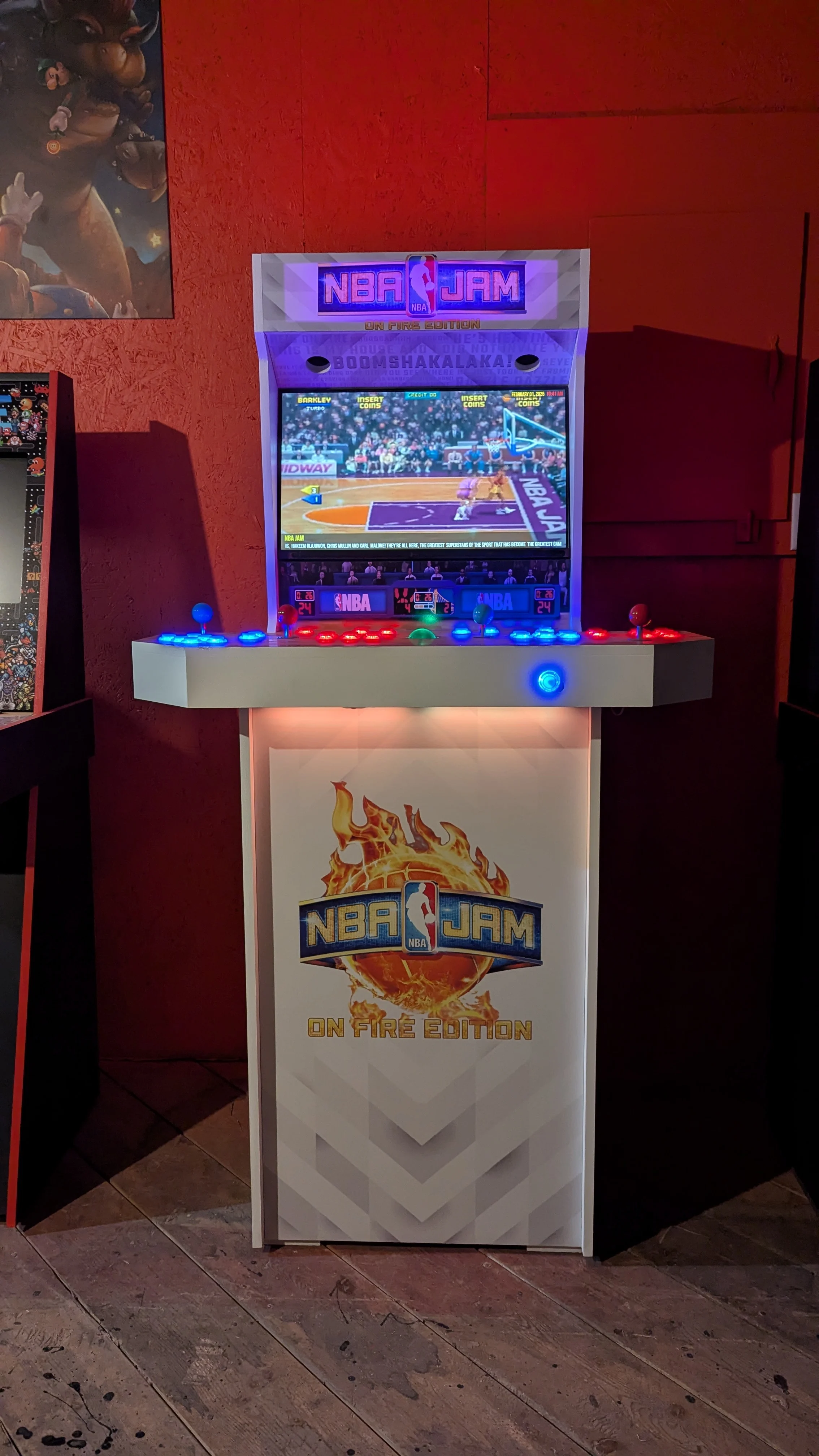 NBA Jam machine with warm front lighting and purple illuminated marquee