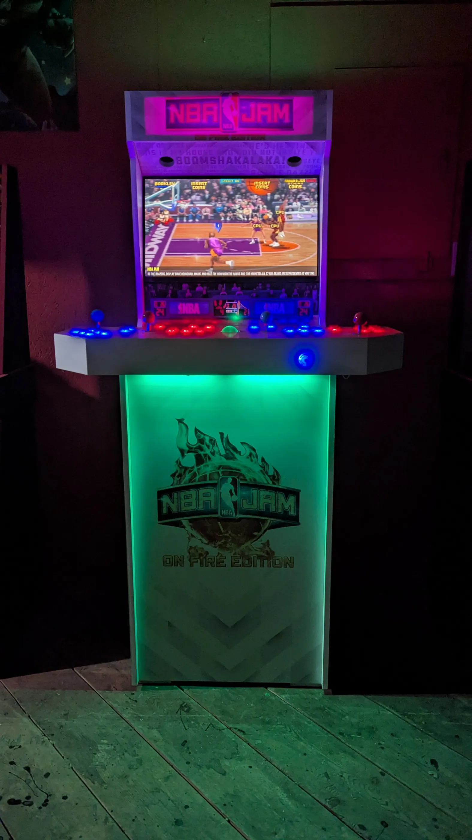 NBA Jam On Fire Edition custom arcade machine glowing in a dark room
