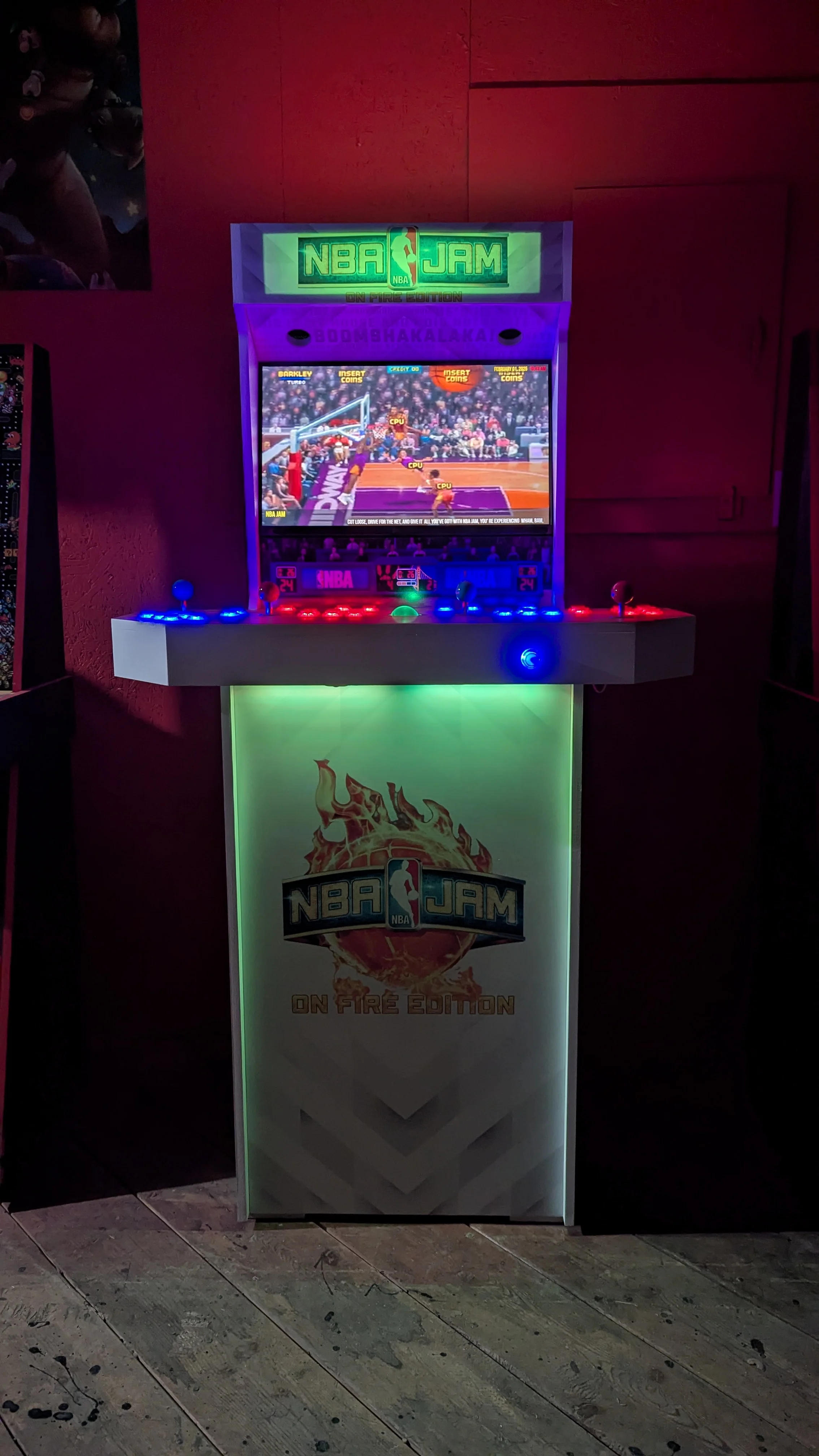 NBA Jam cabinet glowing green and purple during gameplay