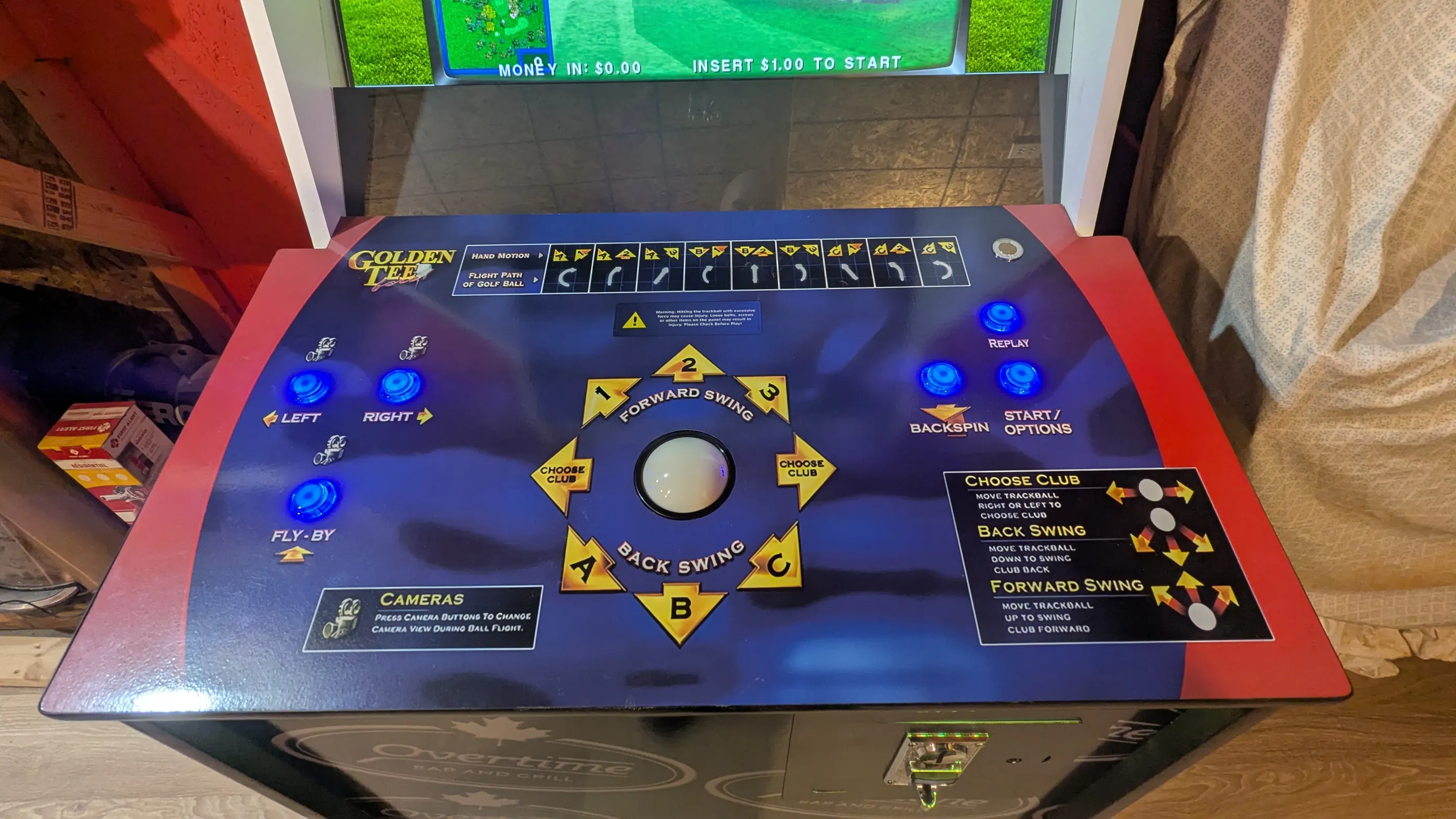 Golden Tee Fore arcade machine coin door and Overtime cabinet lighting detail