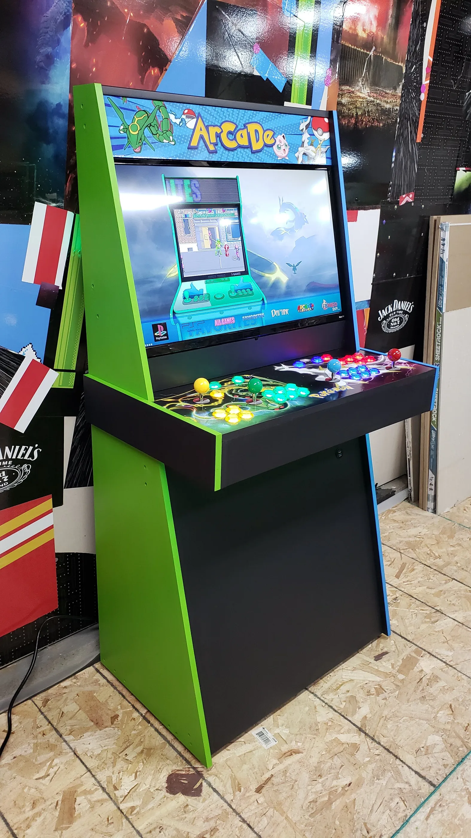 Angled view of the Pokémon arcade with green and blue cabinet trim