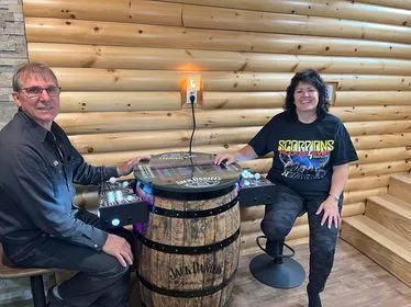 Whiskey barrel arcade in a finished entertainment room