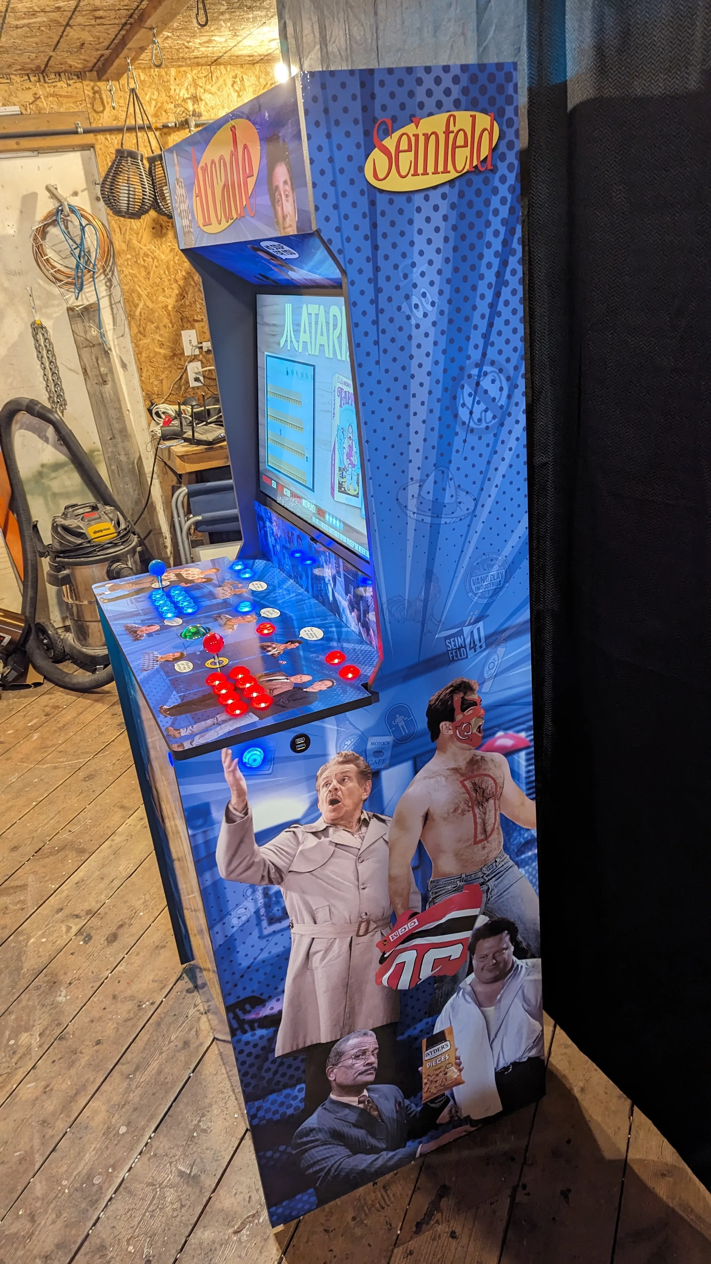 Side view of the Seinfeld arcade machine with custom character artwork