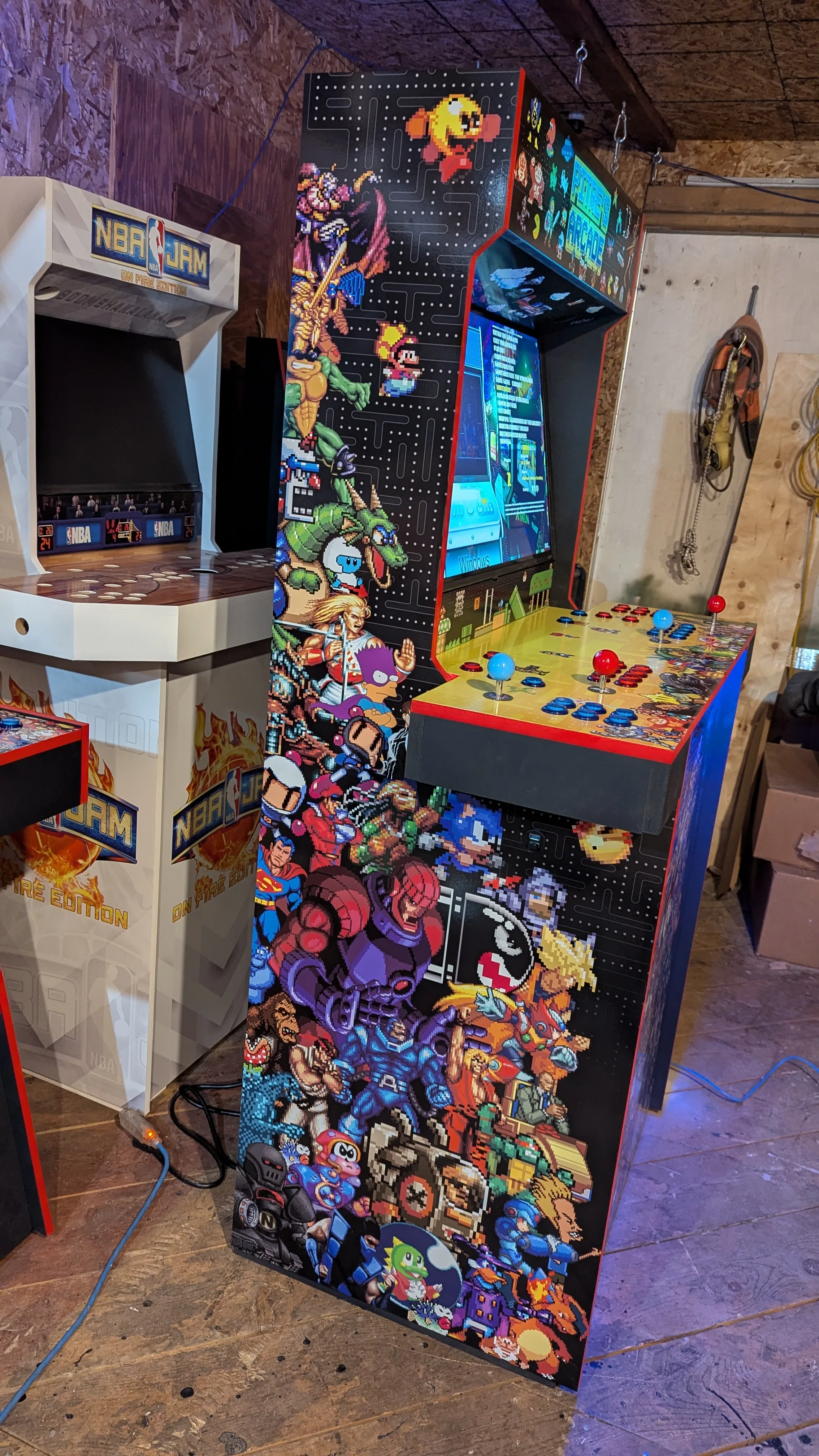 Side view of the Pixel Edition Epic arcade cabinet with pixel-art character wrap