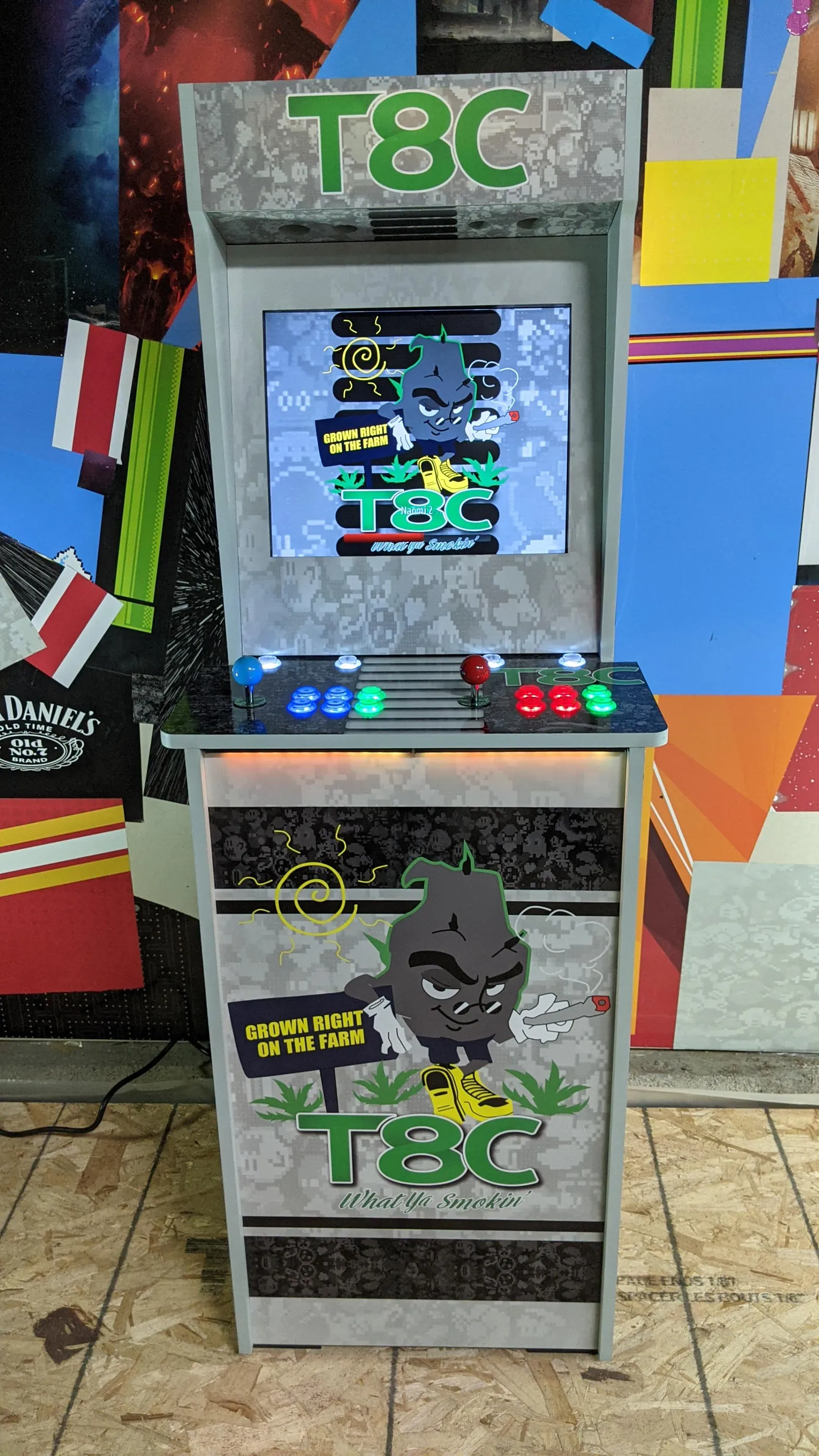 Front view of the T8C What Ya Smokin' arcade machine with custom wrap and illuminated controls